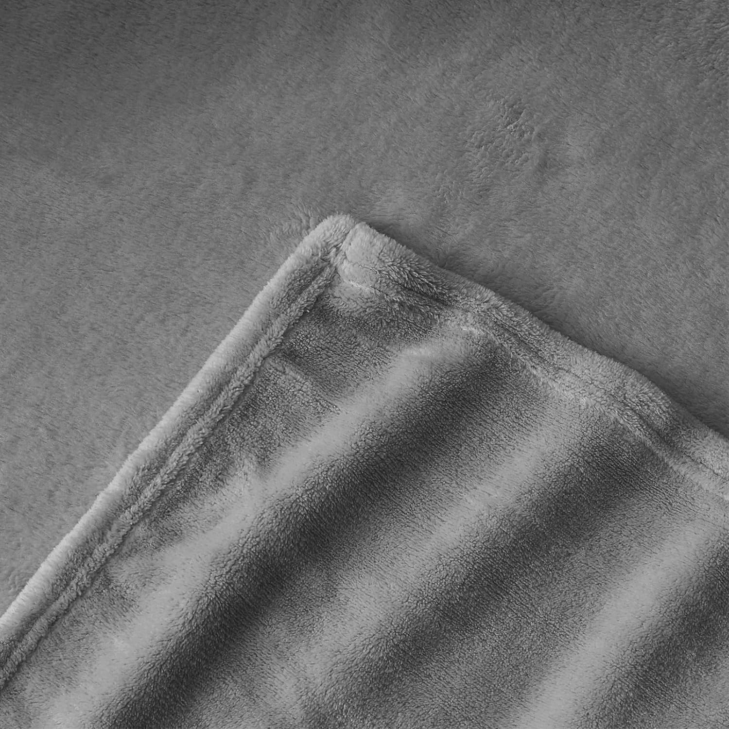 Kathy Ireland Flannel Solid Microplush Bed Blankets